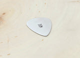 Guitar pick stamped in aluminum with an Owl