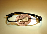 Leather bracelet with bronze guitar on copper play music edition