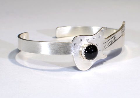 Sterling silver guitar bracelet with musical inspiration and black onyx gemstone