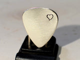Sterling silver guitar pick brimming with love and a heart