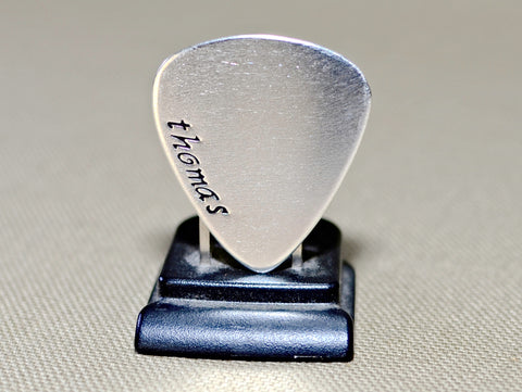 Silver shop guitar pick