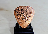 Copper snowflake guitar pick for wintertime tunes