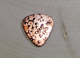 Copper snowflake guitar pick for wintertime tunes