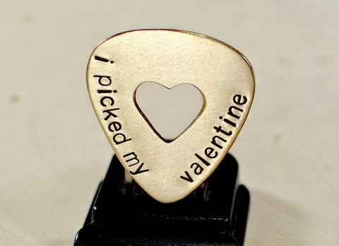 Bronze guitar pick for Valentines Day with a heart and message of love