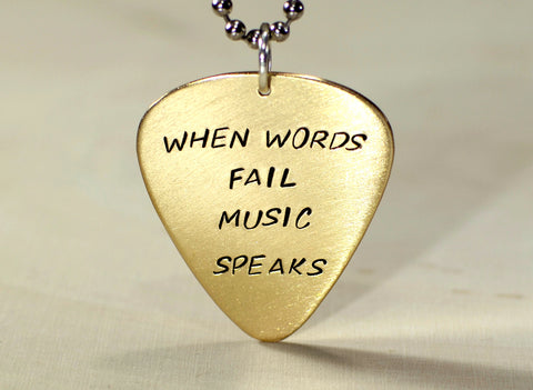 When words fail music speaks 14K yellow gold guitar pick pendant
