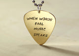 When words fail music speaks 14K yellow gold guitar pick pendant