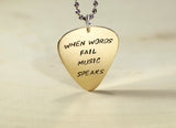When words fail music speaks 14K yellow gold guitar pick pendant